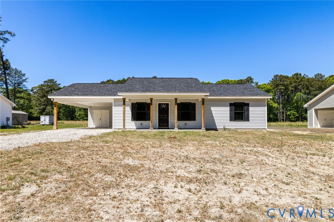 2085 Skippers Road Emporia, VA 23847 - Photo 2 of 34 a front view of a house with a garden