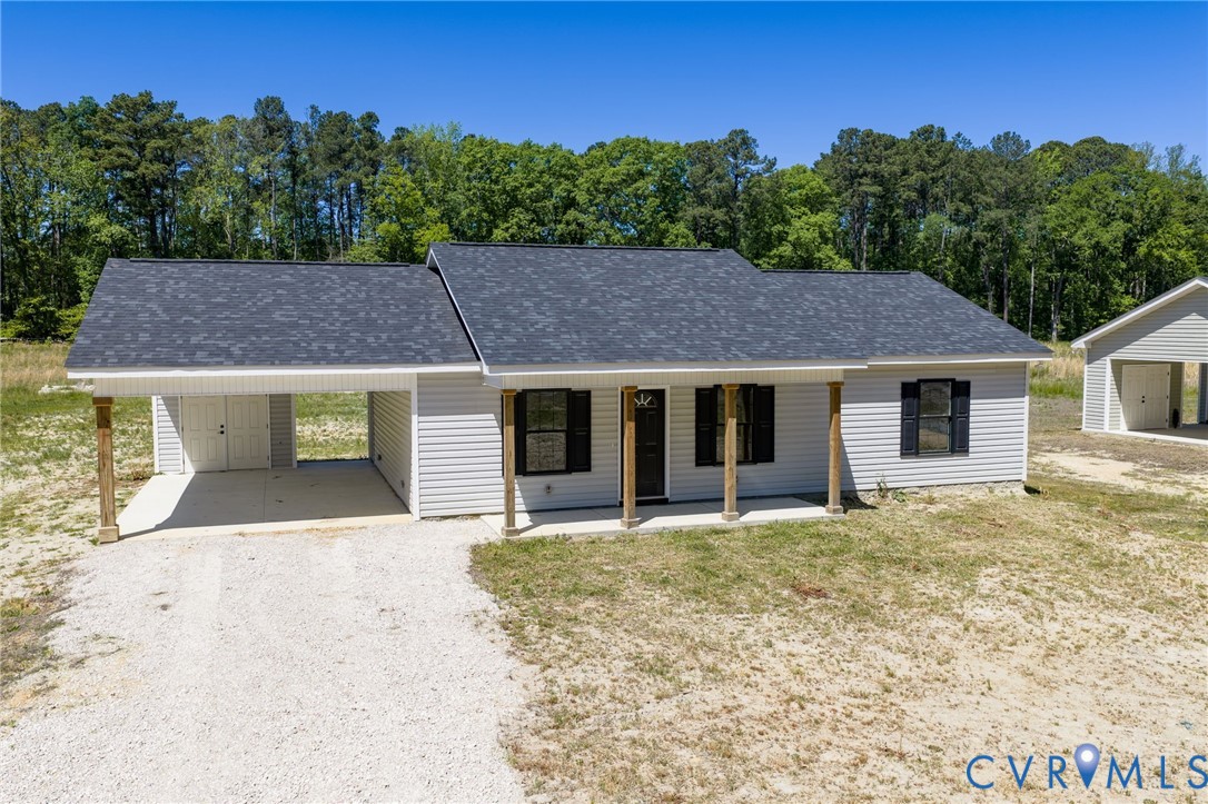 2085 Skippers Road Emporia, VA 23847 - Photo 24 of 34 a house that has a tree in front of it
