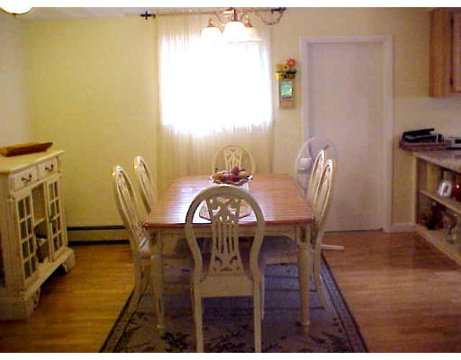 7 Francine Road Framingham, MA 01701 - Photo 14 of 26 a view of a dining room with furniture and wooden floor