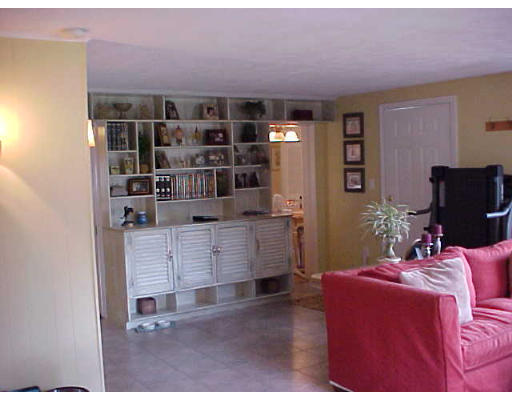 7 Francine Road Framingham, MA 01701 - Photo 18 of 26 a room with furniture a rug and a book shelf