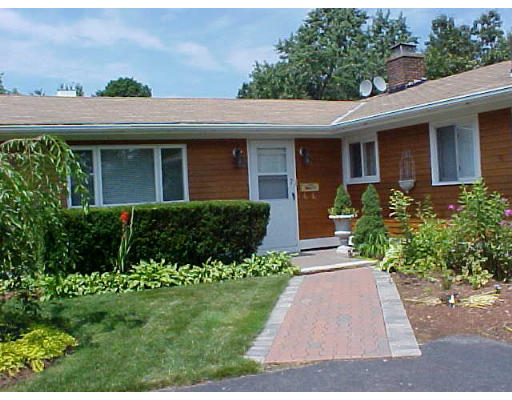 7 Francine Road Framingham, MA 01701 - Photo 2 of 26 a front view of a house with a garden
