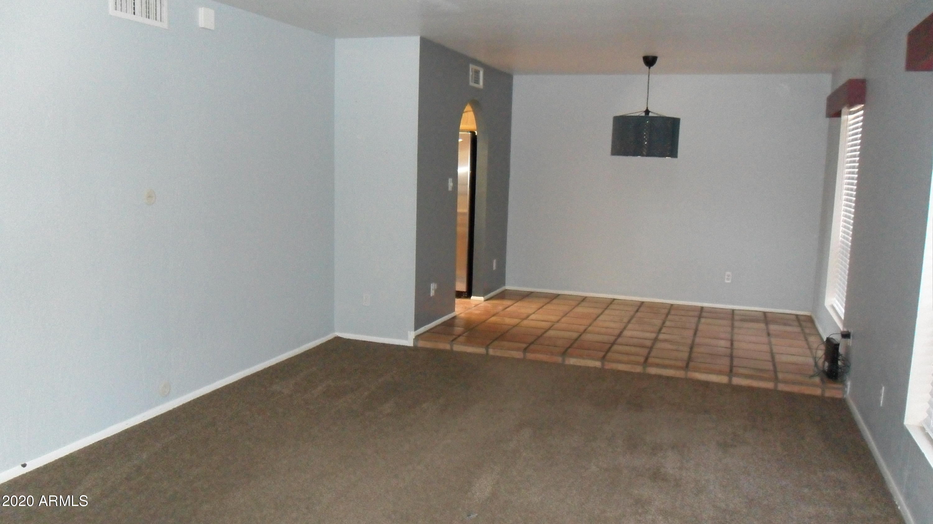 6935 East Hearn Road Scottsdale, AZ 85254 - Photo 2 of 19 LIVING ROOM FROM FRONT DOOR