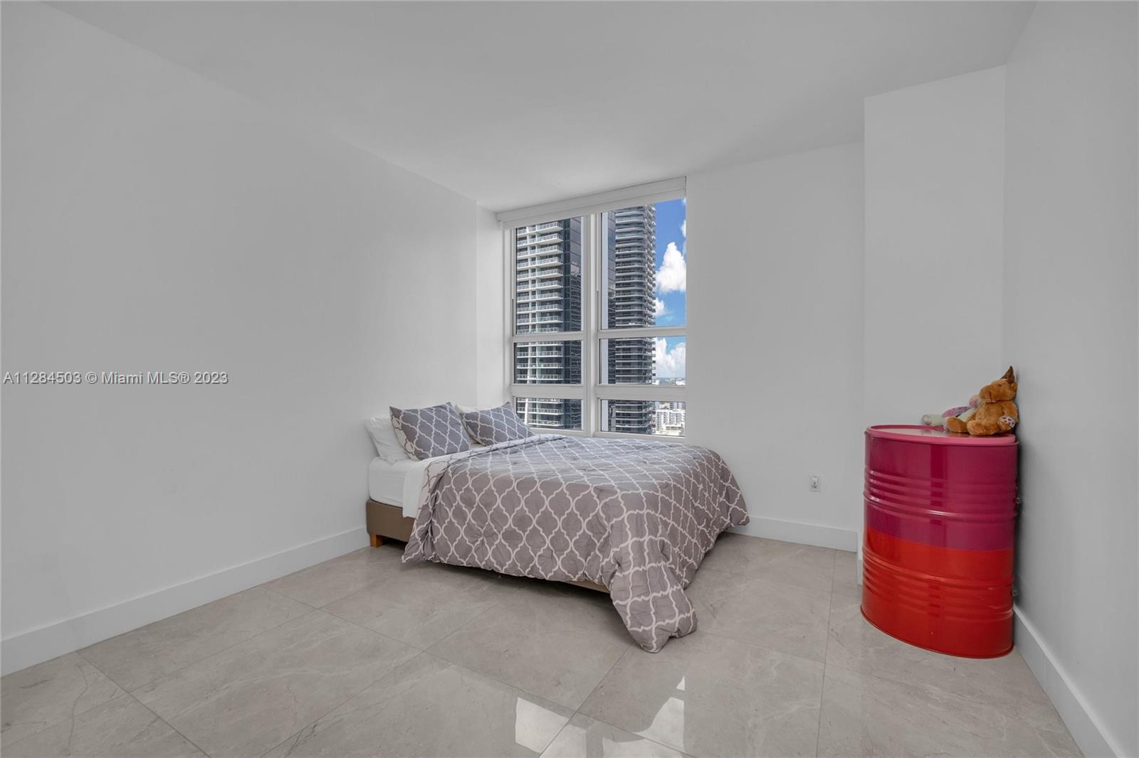 Brickell Miami, FL 33131 - Photo 12 of 29 a bedroom with a bed and a window