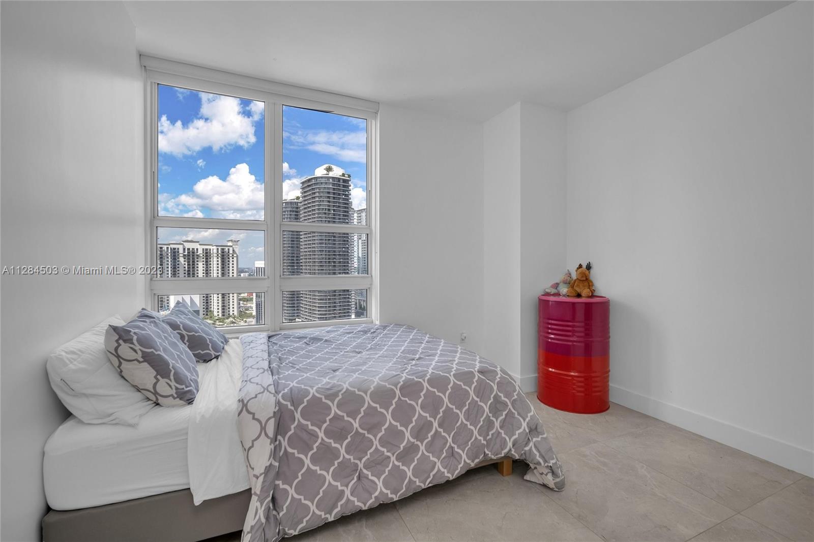 Brickell Miami, FL 33131 - Photo 14 of 29 a bedroom with a bed and a window