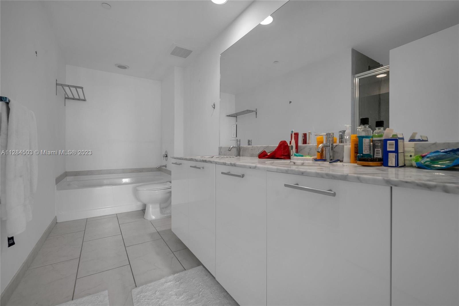 Brickell Miami, FL 33131 - Photo 18 of 29 a bathroom with a sink and toilet