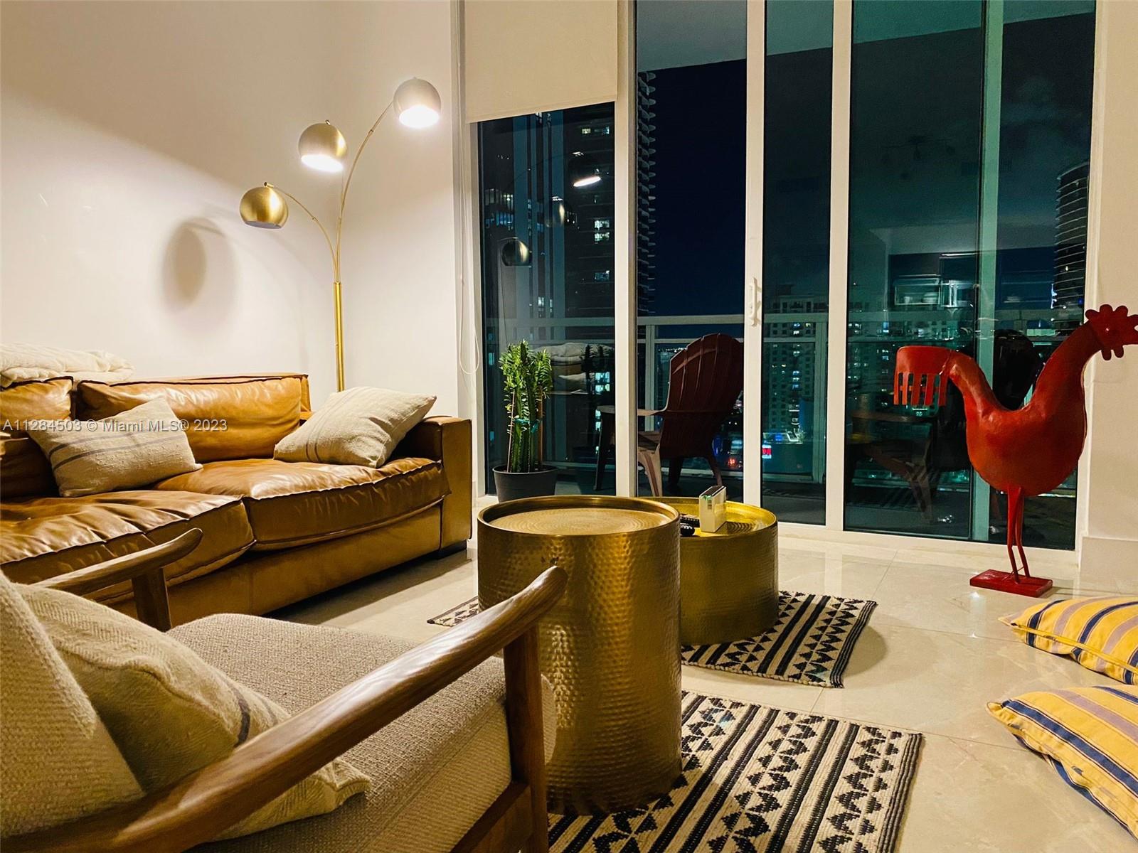 Brickell Miami, FL 33131 - Photo 2 of 29 a living room with furniture and large window