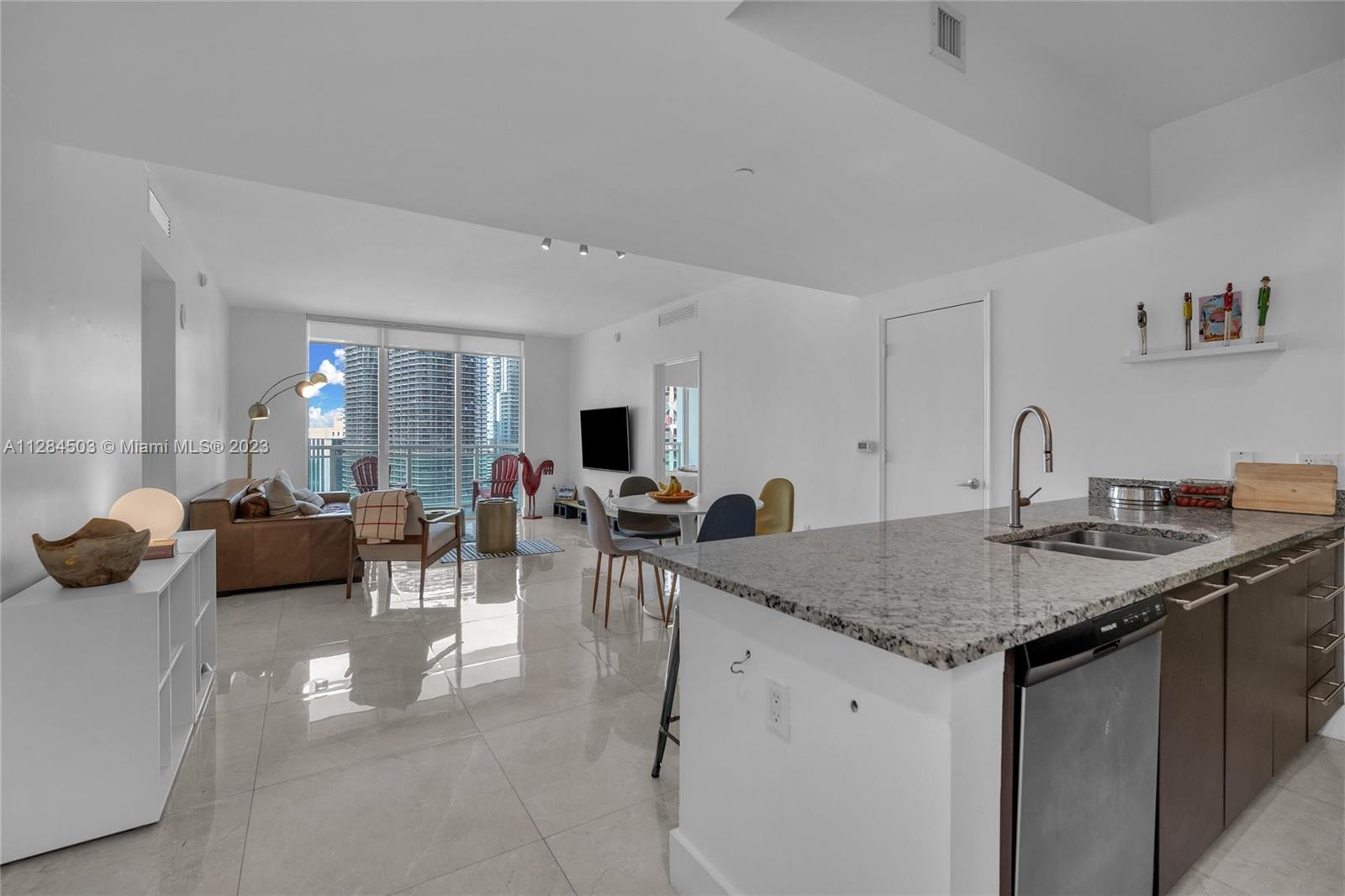 Brickell Miami, FL 33131 - Photo 3 of 29 a view of a kitchen living room with furniture and a sink