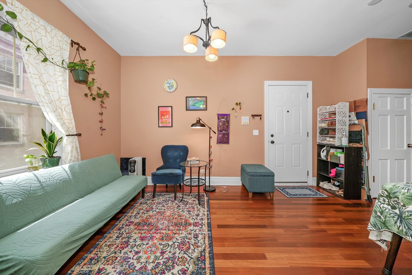5342 North Winthrop Avenue, Unit 2E Chicago, IL 60640 - Photo 3 of 8 a living room with furniture and a lamp