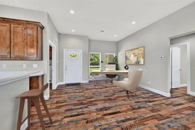 a living room with furniture a window and a fireplace