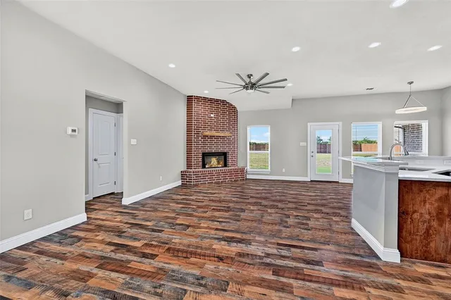 a spacious bedroom with a bed and a fireplace
