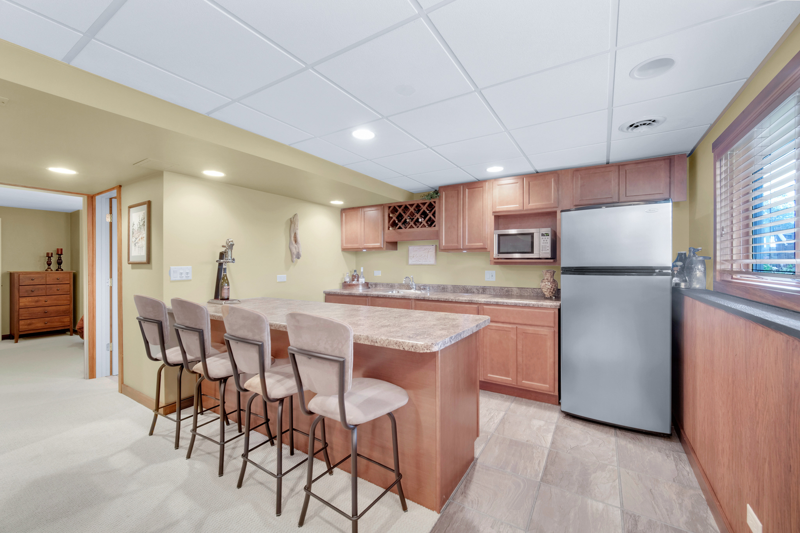 1840 Marne Road Bolingbrook, IL 60490 - Photo 29 of 37 a kitchen with refrigerator and chairs