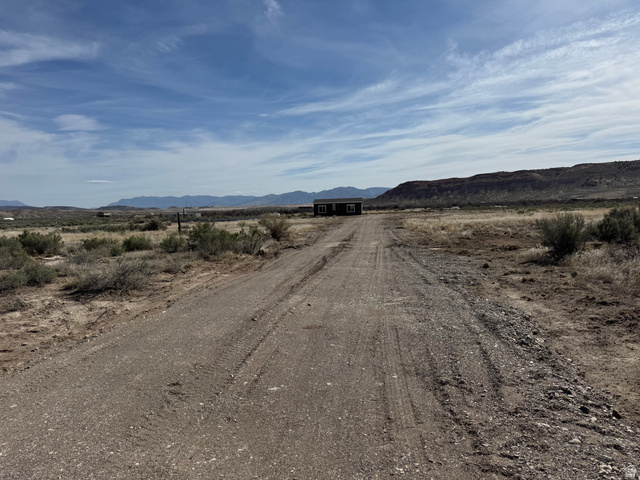 32 Sevier River, Unit 32 Levan, UT 84639 - Photo 29 of 50 View of gravel road featuring a mountain view and a view of rural landscapes.