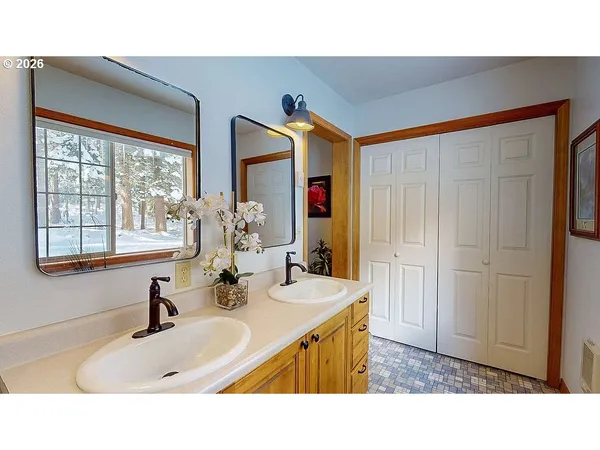 a bathroom with a sink mirror and a bathtub