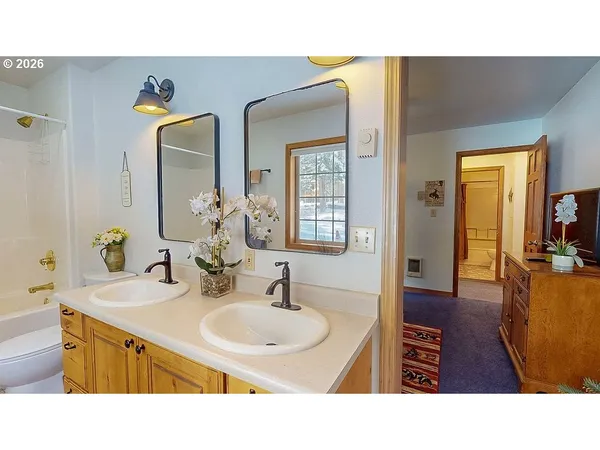 a bathroom with sink and mirror