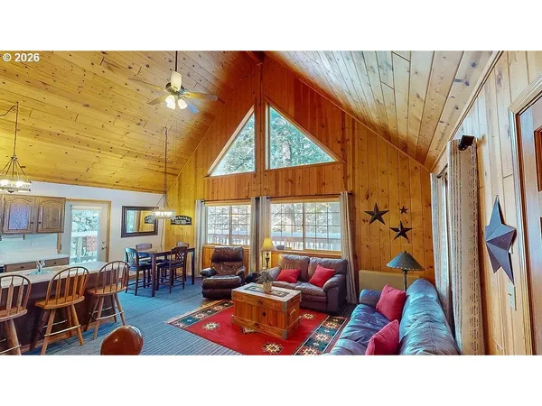 a outdoor living space with furniture and a flat screen tv