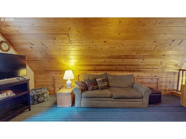 a living room with couch and a fireplace