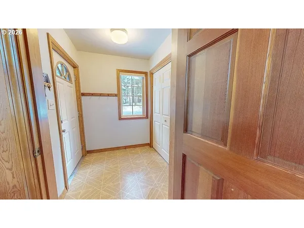 a open living room with a couch and a window