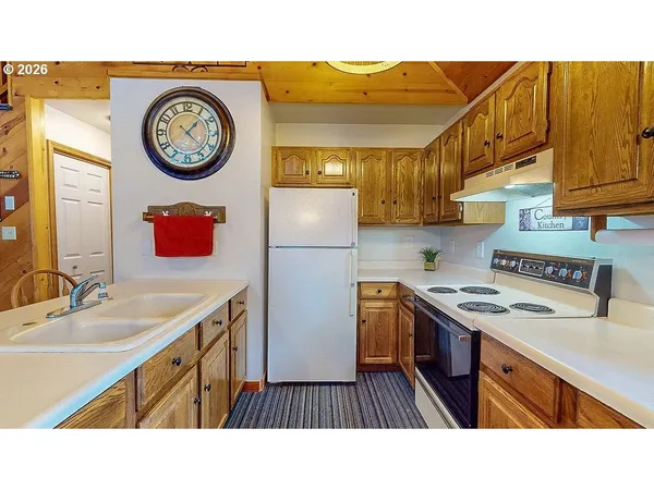 a kitchen with a sink and a stove