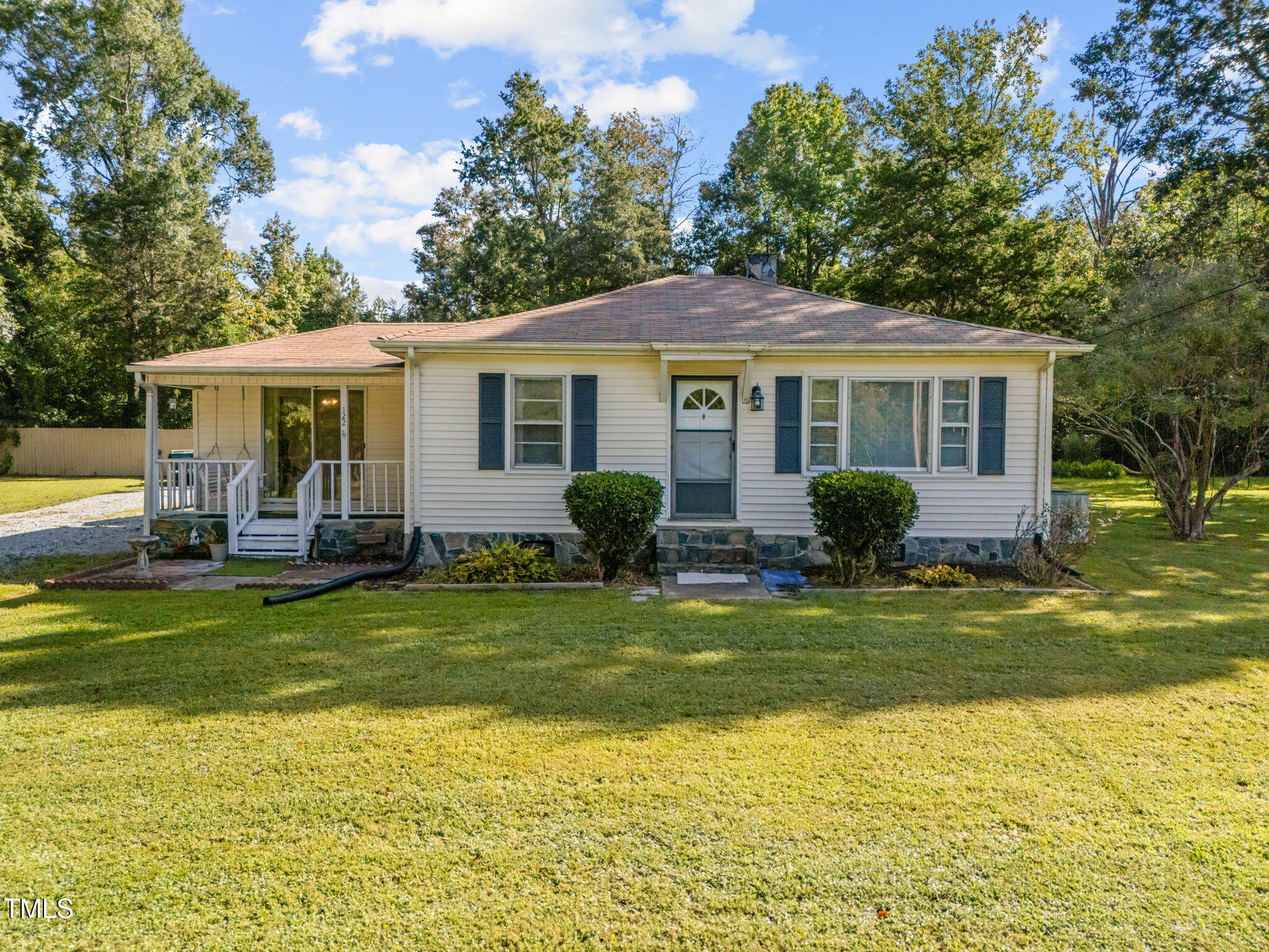 a view of a house with a backyard patio and swimming pool