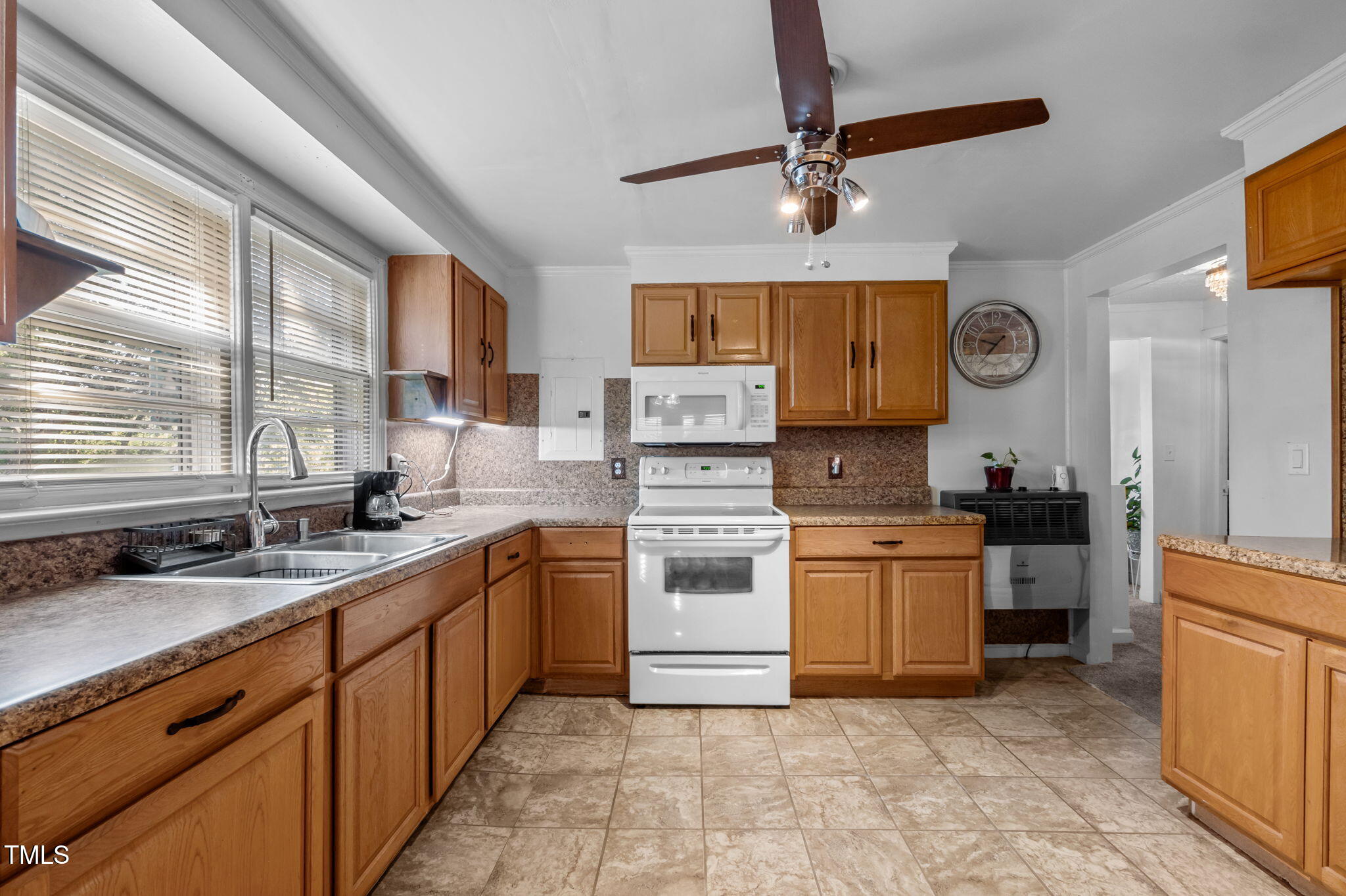 122 Old Surl Road Roxboro, NC 27574 - Photo 21 of 45 a kitchen with stove cabinets and a window