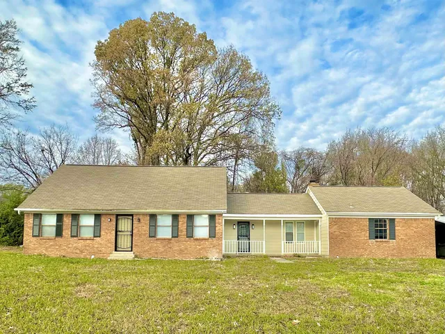 front view of a house with a yard