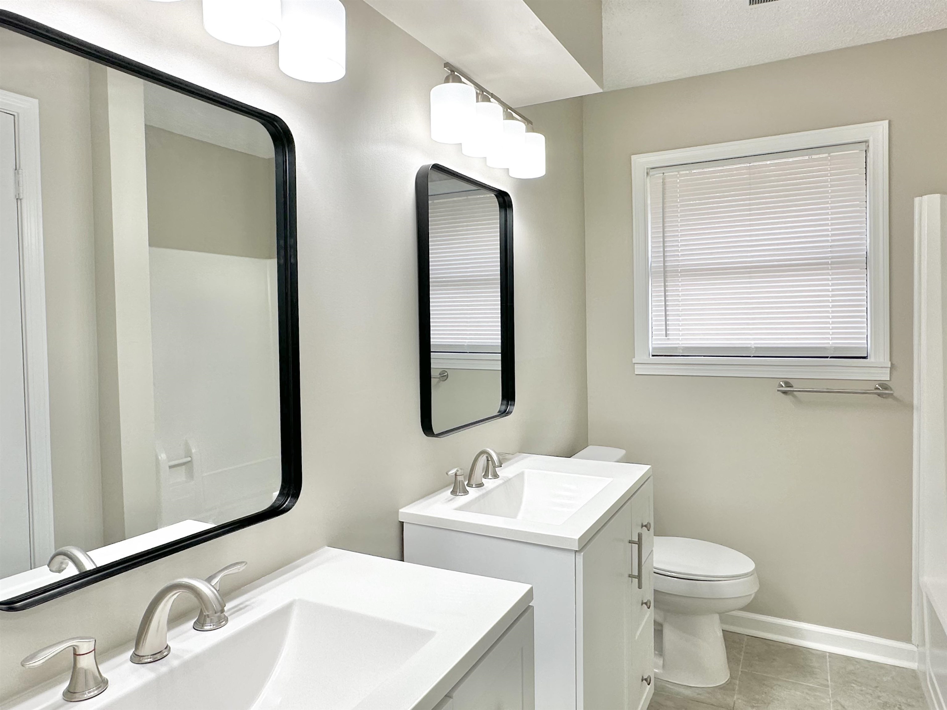 4376 Coleman Road Memphis, TN 38128 - Photo 14 of 21 a bathroom with 2 sink and a mirror