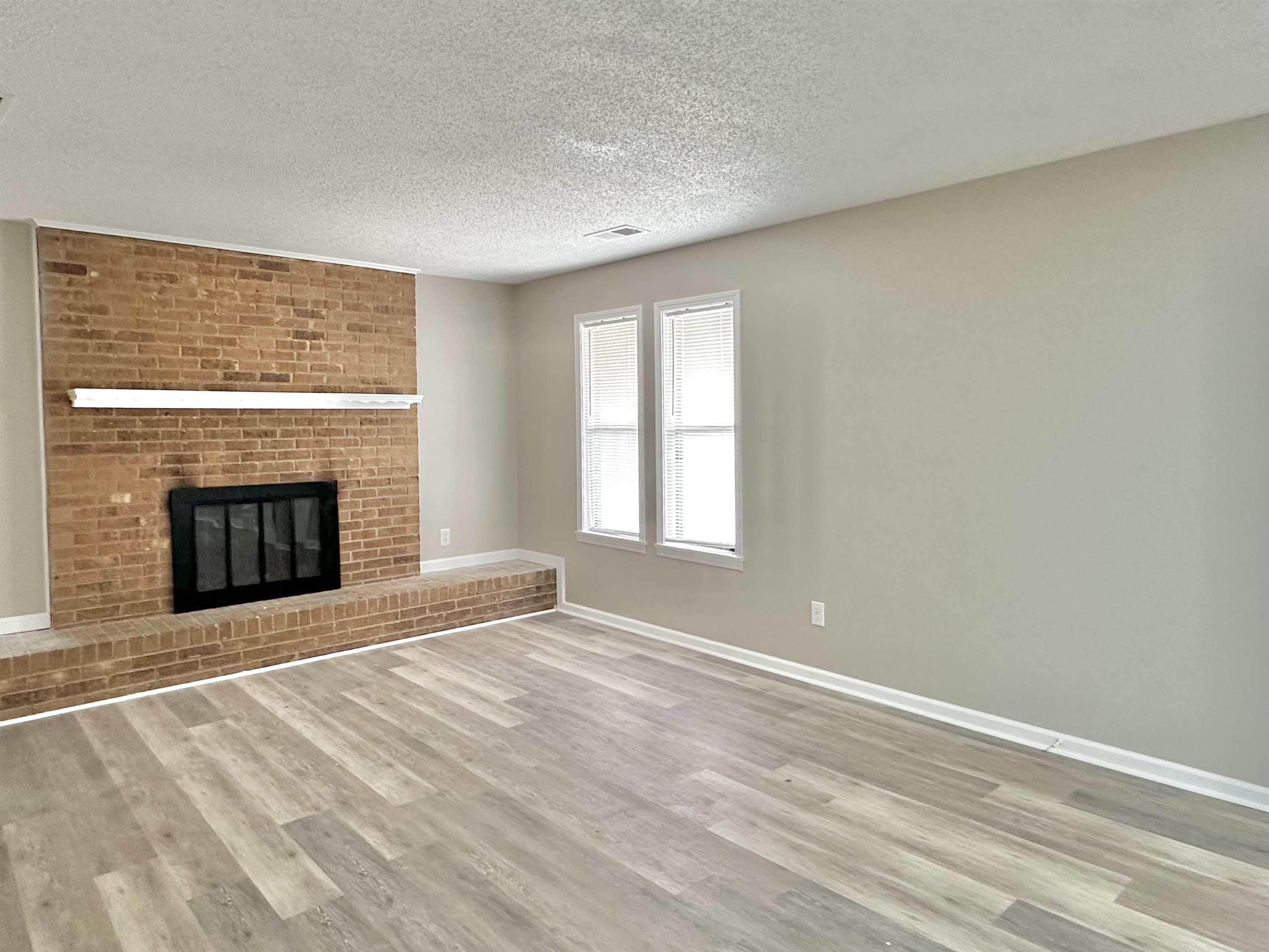 4376 Coleman Road Memphis, TN 38128 - Photo 4 of 21 a view of an empty room with a window and fireplace
