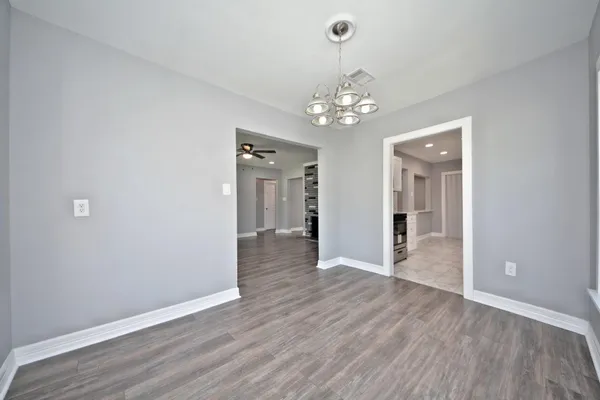 a kitchen with stainless steel appliances granite countertop a stove and a microwave