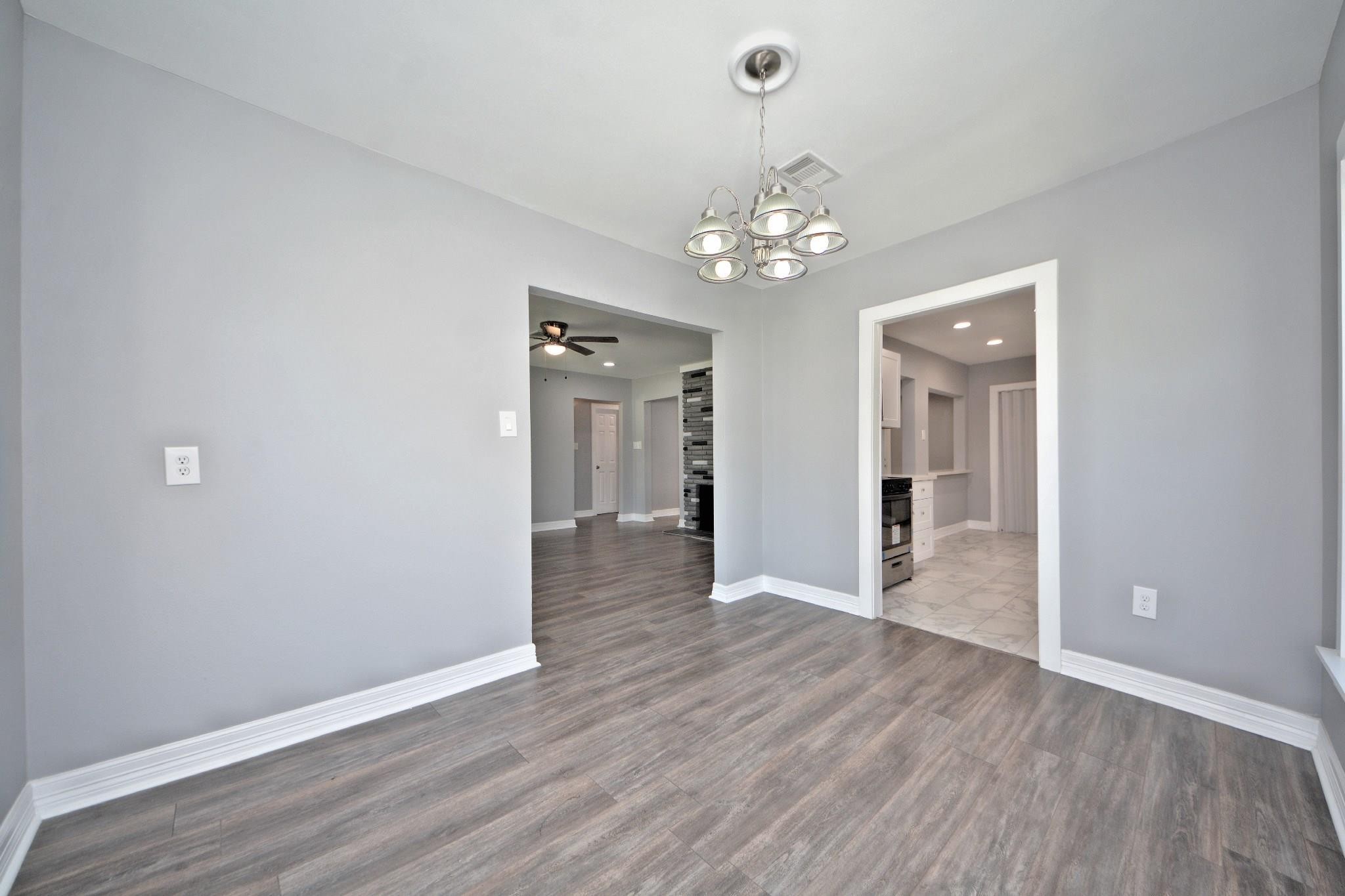 3834 Rosedale Street Houston, TX 77004 - Photo 24 of 48 wooden floor in an empty room with a window
