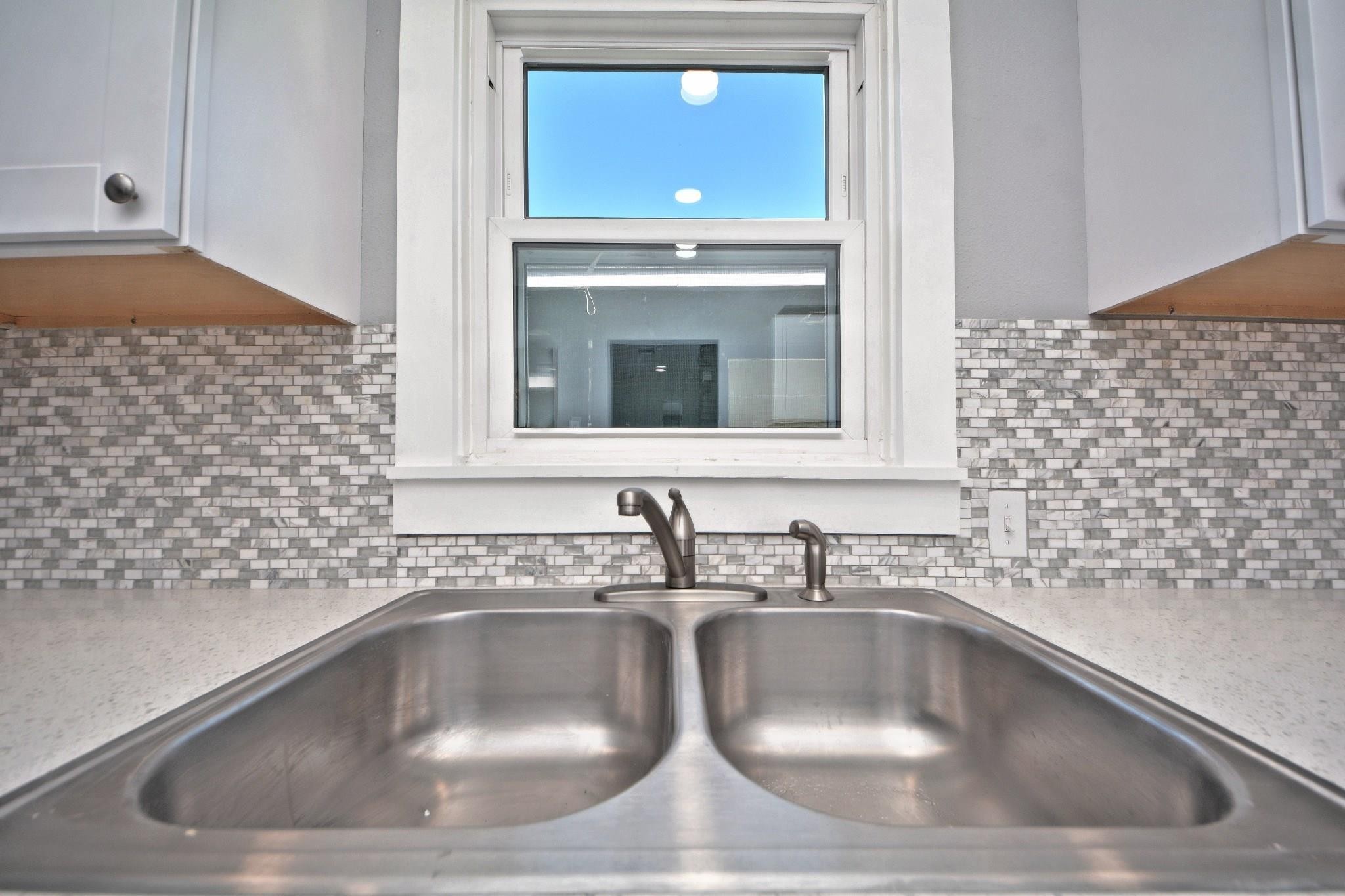3834 Rosedale Street Houston, TX 77004 - Photo 26 of 48 a kitchen with a sink and a stove