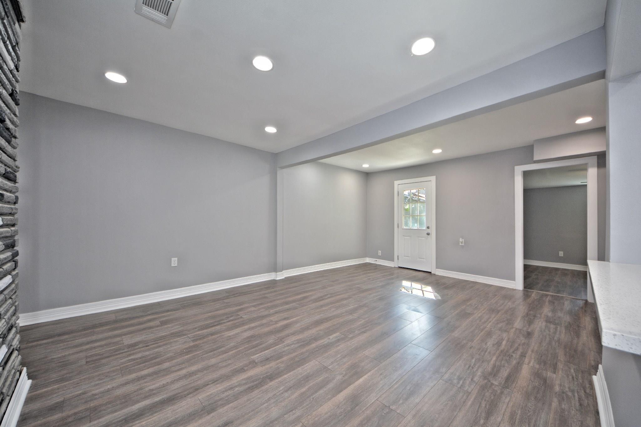 3834 Rosedale Street Houston, TX 77004 - Photo 28 of 48 a view of an empty room with wooden floor