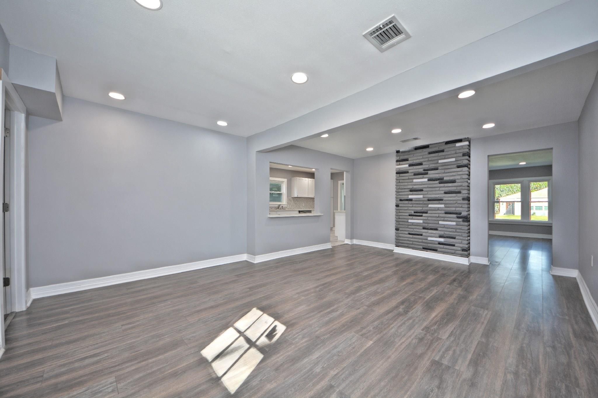 3834 Rosedale Street Houston, TX 77004 - Photo 30 of 48 wooden floor in an empty room with a window