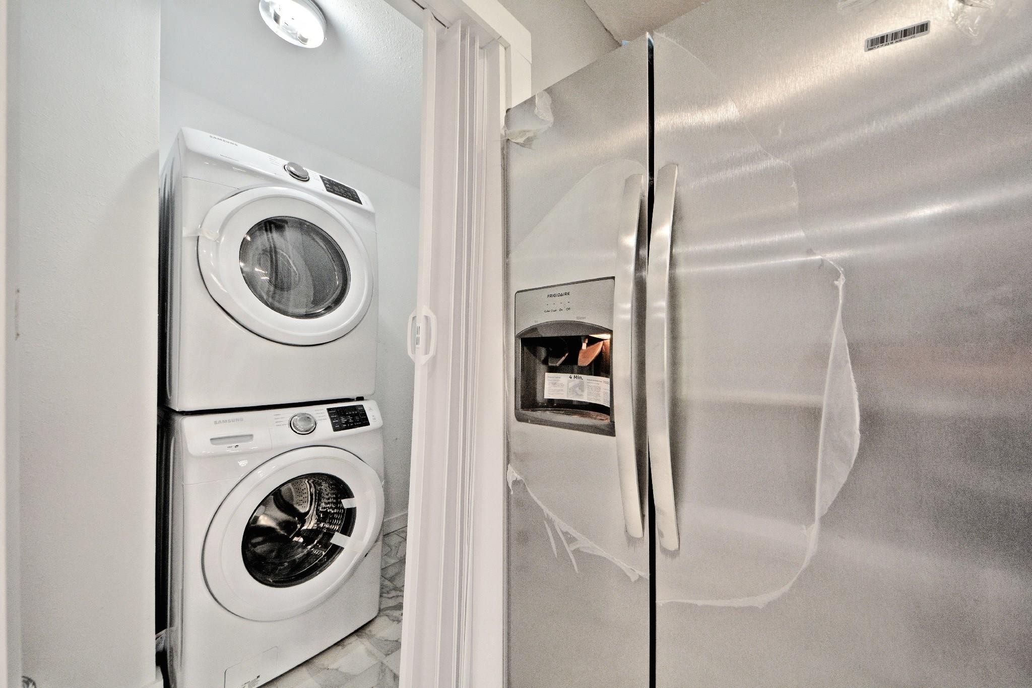 3834 Rosedale Street Houston, TX 77004 - Photo 37 of 48 a utility room with dryer and washer