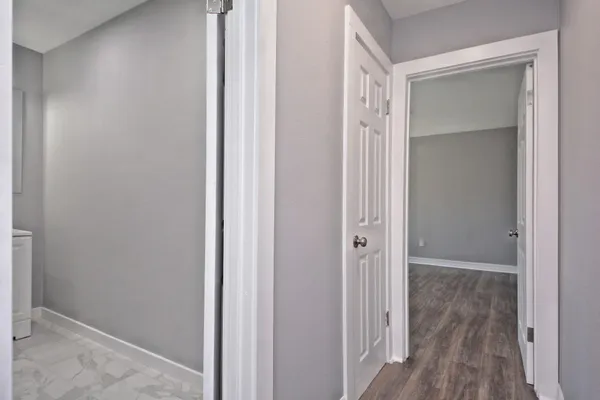 a bathroom with a mirror vanity and a shower