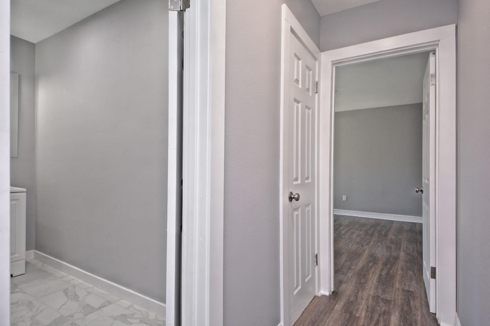 3834 Rosedale Street Houston, TX 77004 - Photo 39 of 48 a view of a hallway with wooden floor