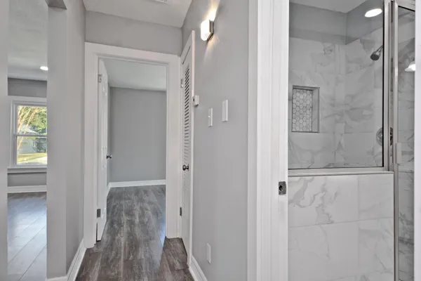a bathroom with a glass shower door