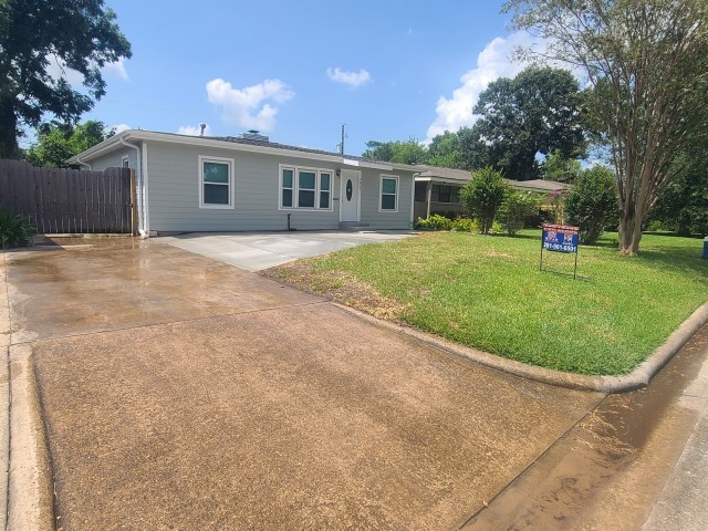 3834 Rosedale Street Houston, TX 77004 - Photo 5 of 48 a backyard of a house with outdoor seating and trees