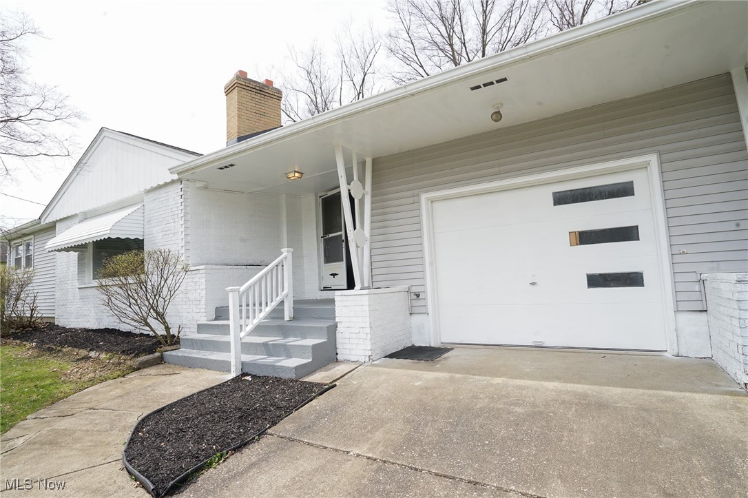 710 Struthers-Liberty Road Campbell, OH 44405 - Photo 2 of 15 Property entrance featuring a chimney and concrete driveway