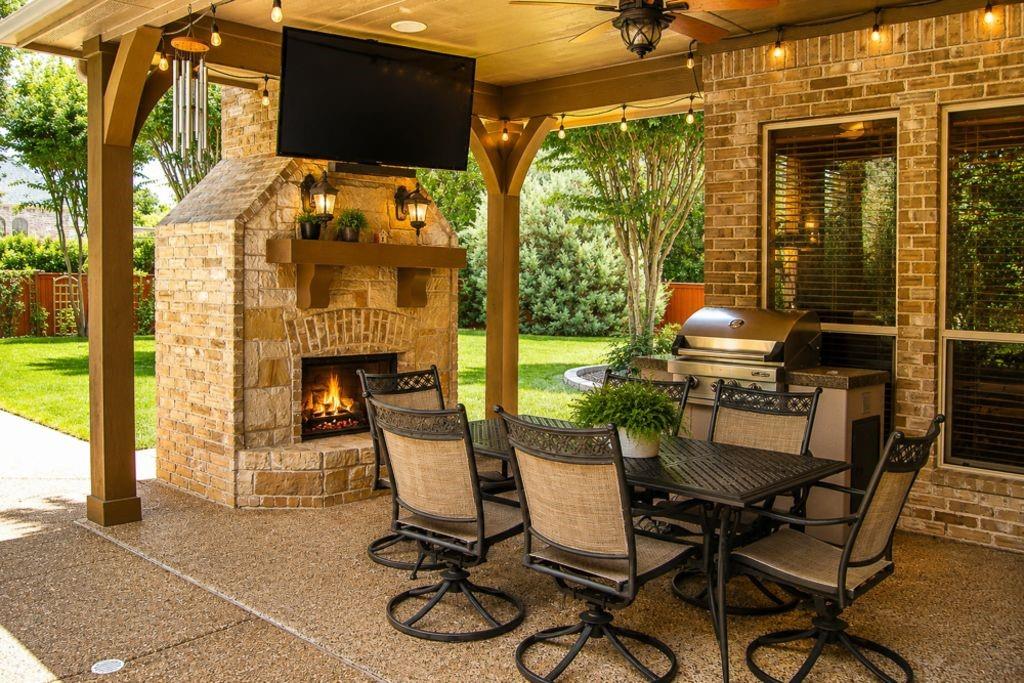 7005 Peter's Path Colleyville, TX 76034 - Photo 37 of 40 a view of a patio with table and chairs and potted plants