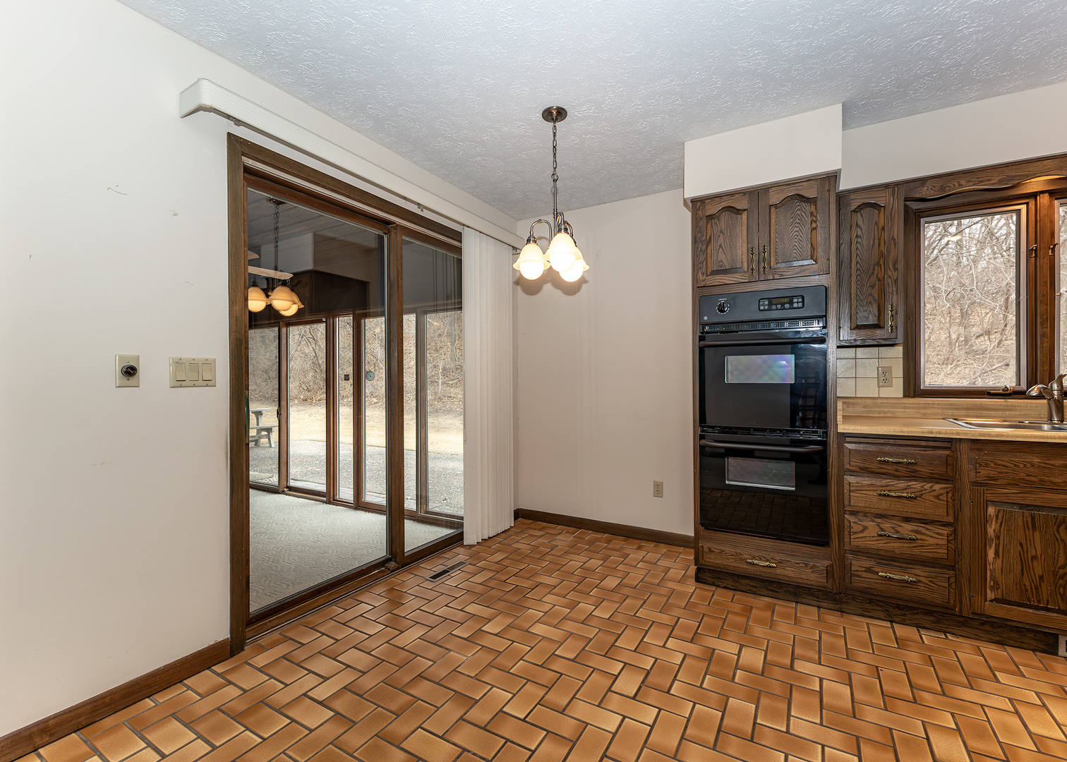 3748 53rd Street Moline, IL 61265 - Photo 11 of 24 a view of a entryway door and hallway with wooden floor