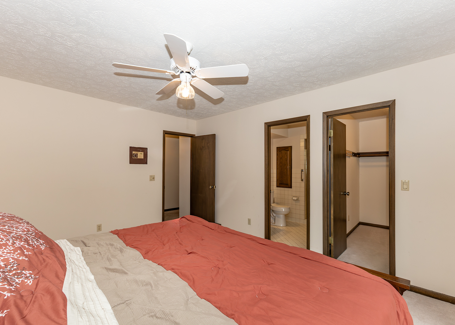 3748 53rd Street Moline, IL 61265 - Photo 17 of 24 a bedroom with a bed and a chandelier