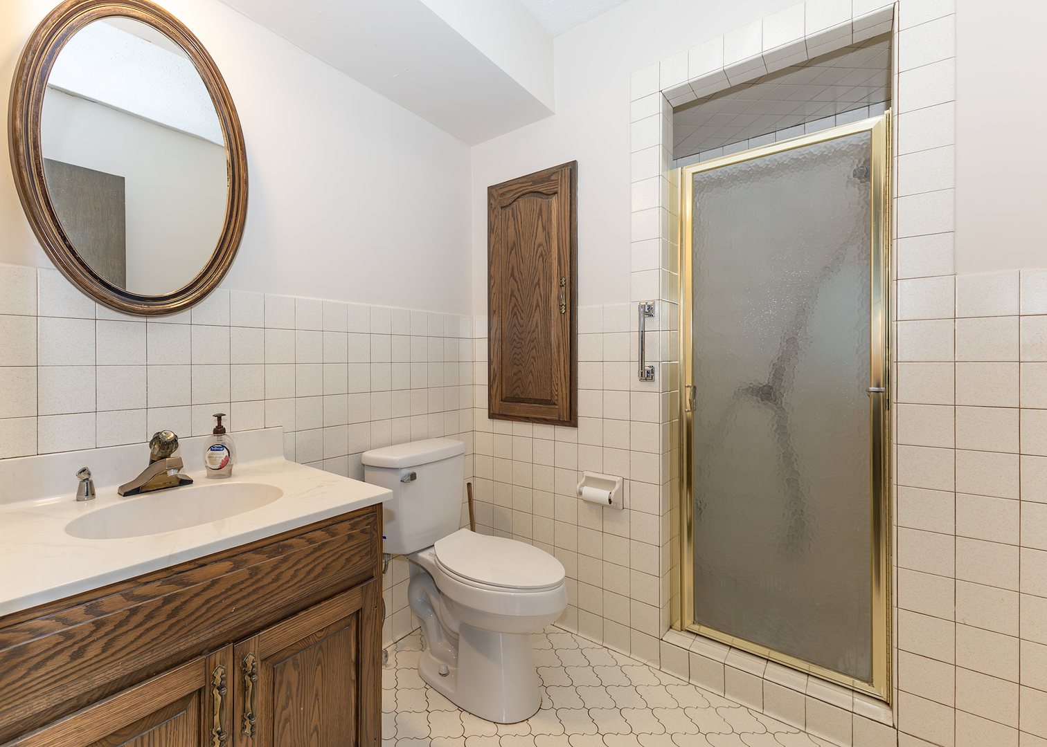 3748 53rd Street Moline, IL 61265 - Photo 18 of 24 a bathroom with a sink a toilet and a mirror
