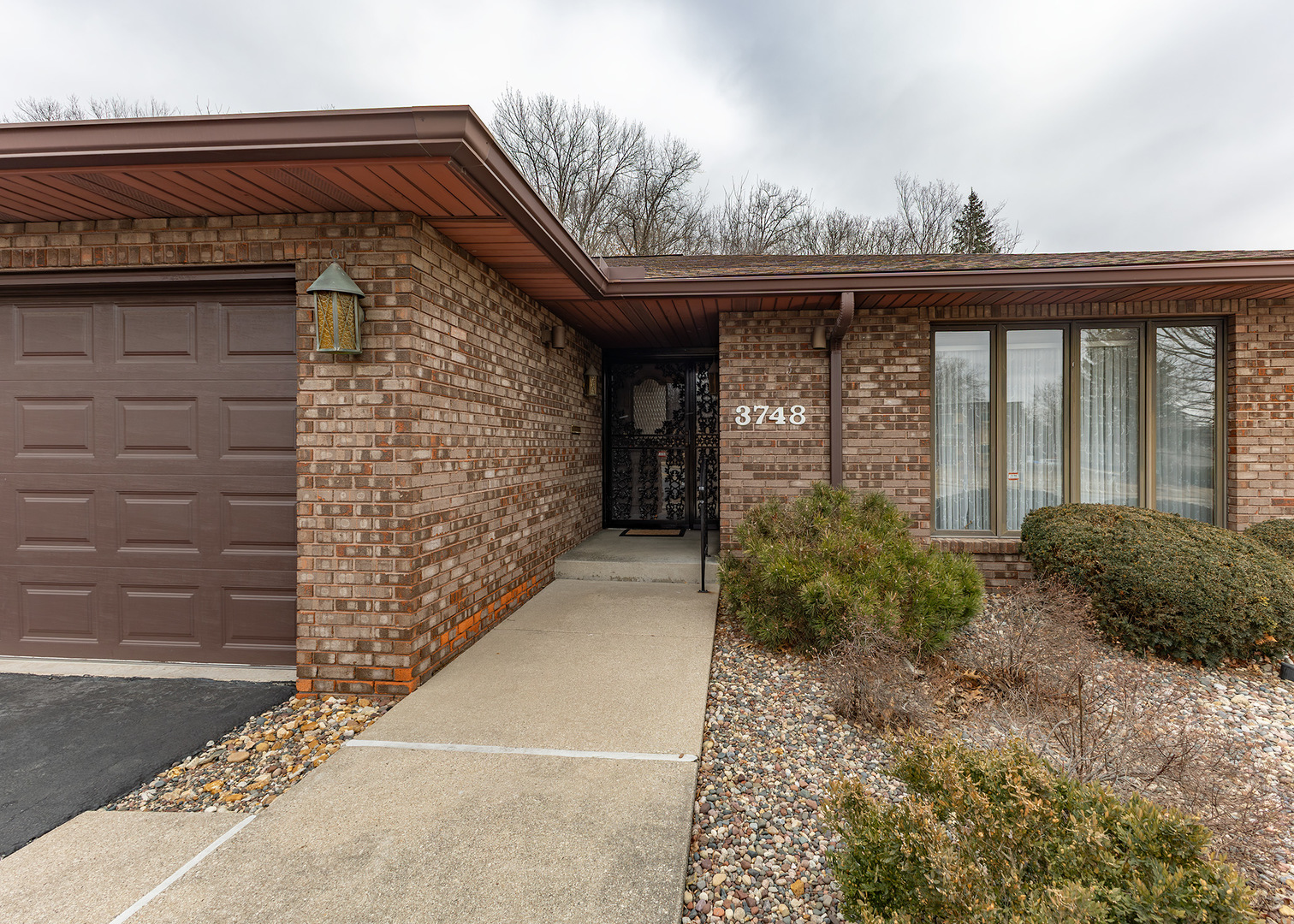 3748 53rd Street Moline, IL 61265 - Photo 2 of 24 a front view of a house with garden