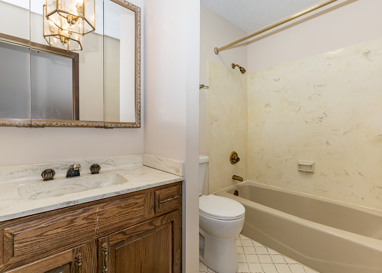 3748 53rd Street Moline, IL 61265 - Photo 21 of 24 a bathroom with a sink a toilet and shower