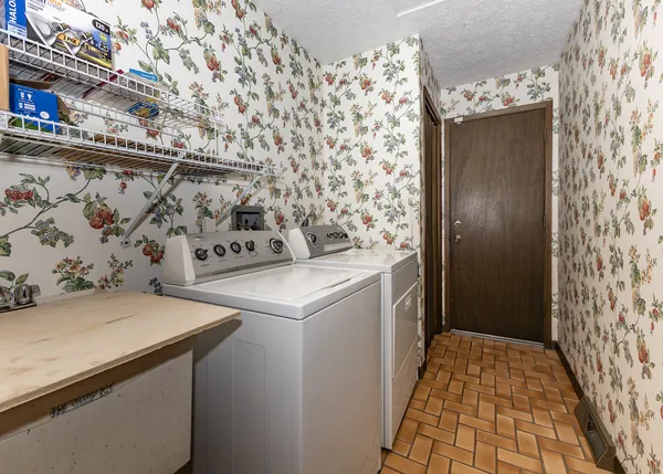 a utility room with dryer and washer