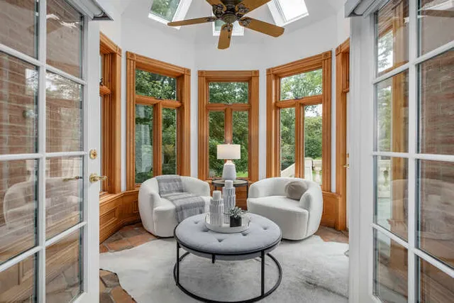 a view of a dining room with furniture wooden floor and chandelier