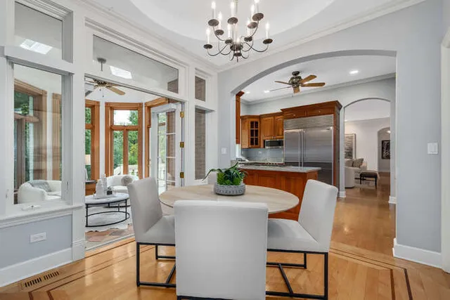 a kitchen with stainless steel appliances granite countertop a sink a window and a refrigerator