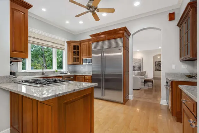 a bedroom with bed and a chandelier