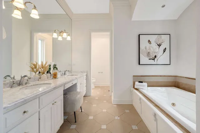 a spacious bathroom with a tub shower and a sink