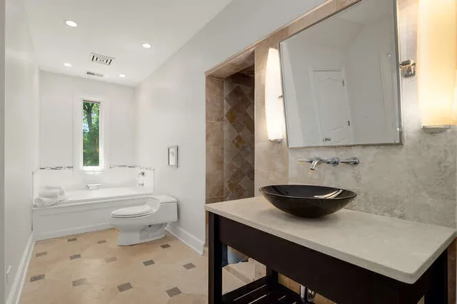 a bedroom with bed and window